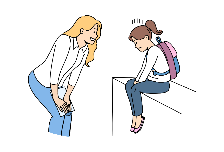 困っている子どもに話しかける女性